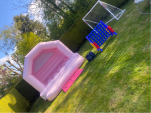Pastel pink bouncy castle hire