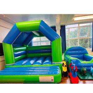 Green and blue bouncy castle with inflatable ball pit package