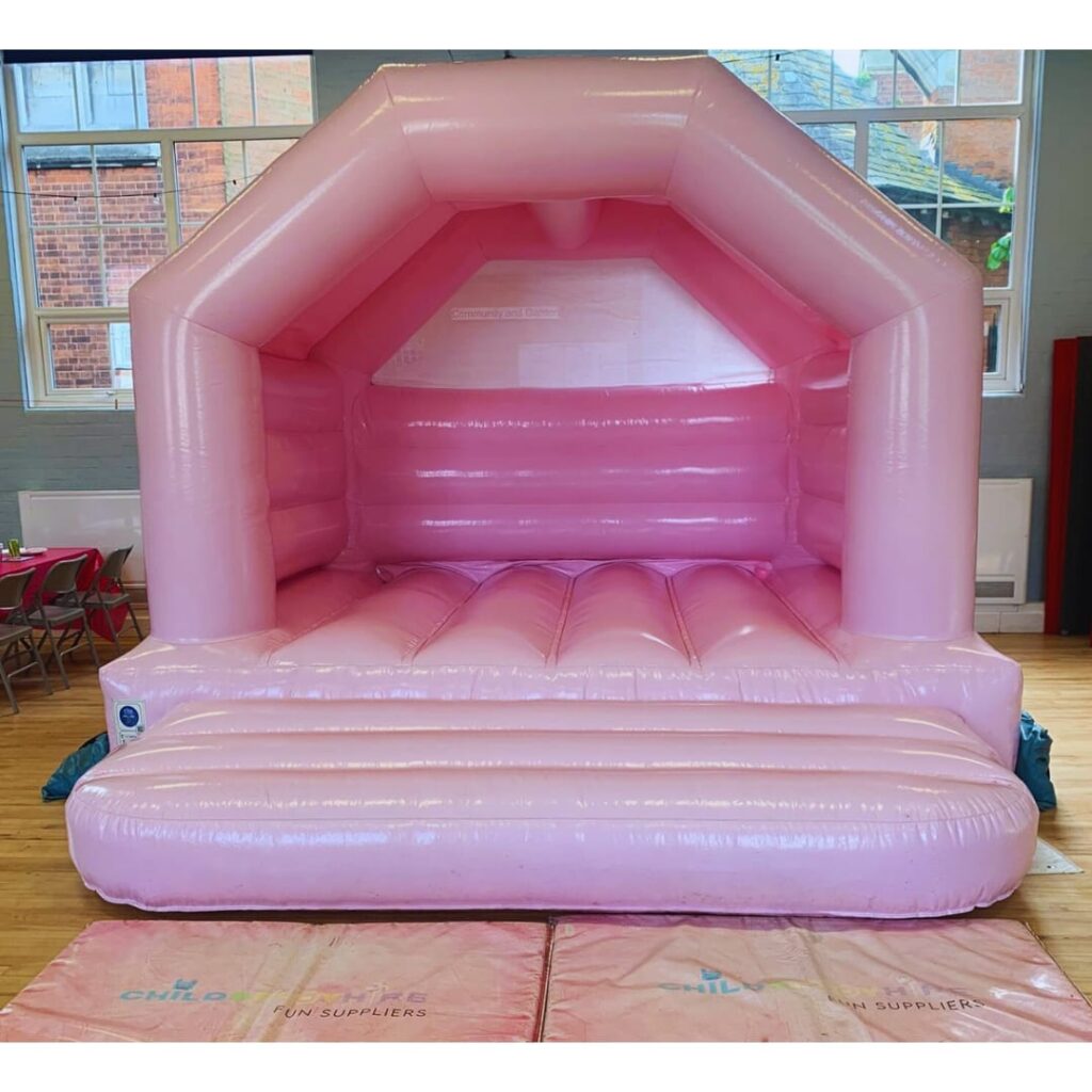 Pastel pink bouncy castle hire
