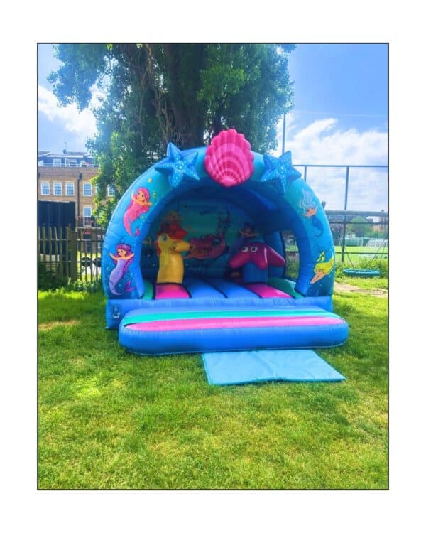 Curved mermaid bouncy castle hire