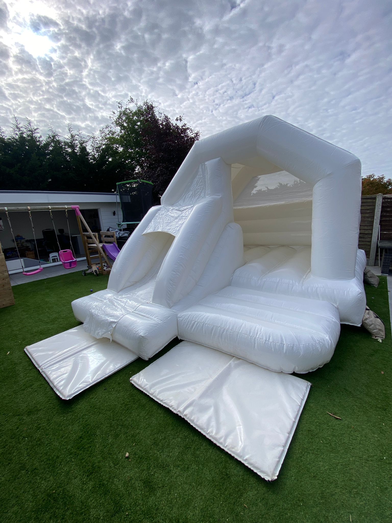 White front slide bouncy castle hire