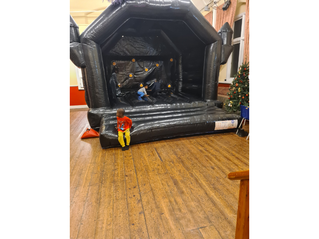Black bouncy castle with hit lit game hire