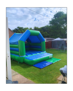 Green and blue bouncy castle hire